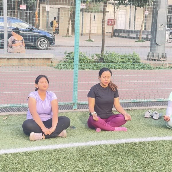 Athletes during the meditation phase of a Corporate Warrior session at VHR Sports