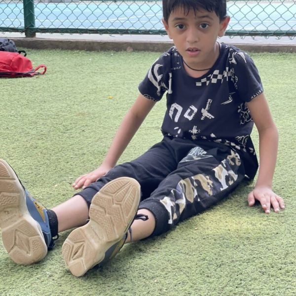 Junior athlete stretching during a VHR Sports training session
