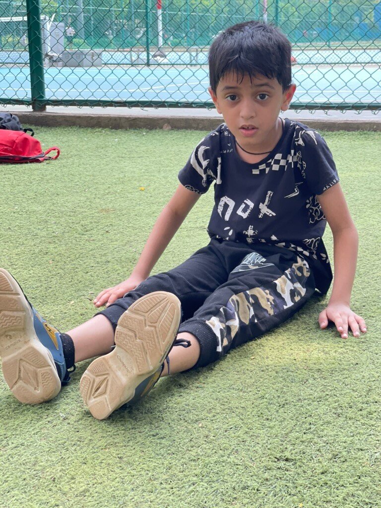 Junior athlete stretching during a VHR Sports training session