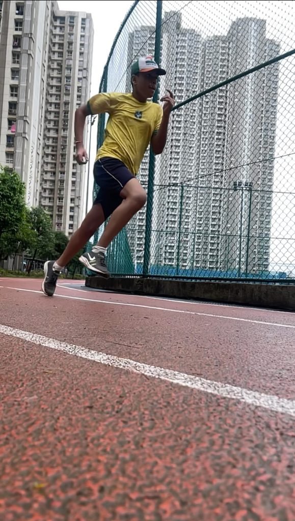 Young athlete sprinting on the athletics track at VHR Sports, Lodha Amara, Thane