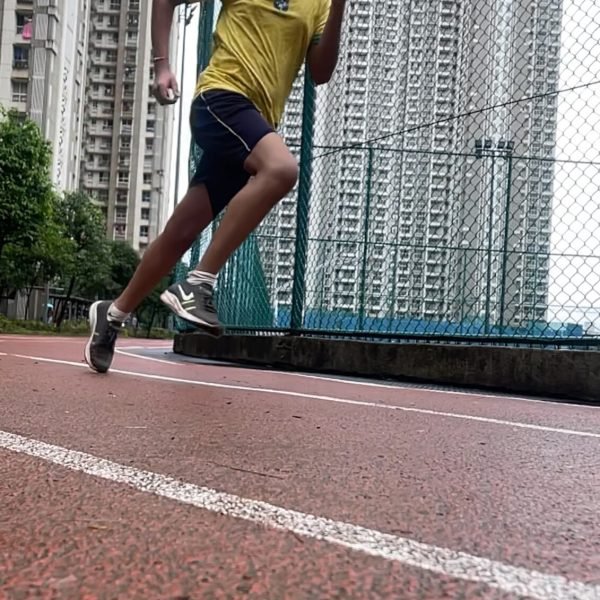 Young athlete sprinting on the athletics track at VHR Sports, Lodha Amara, Thane