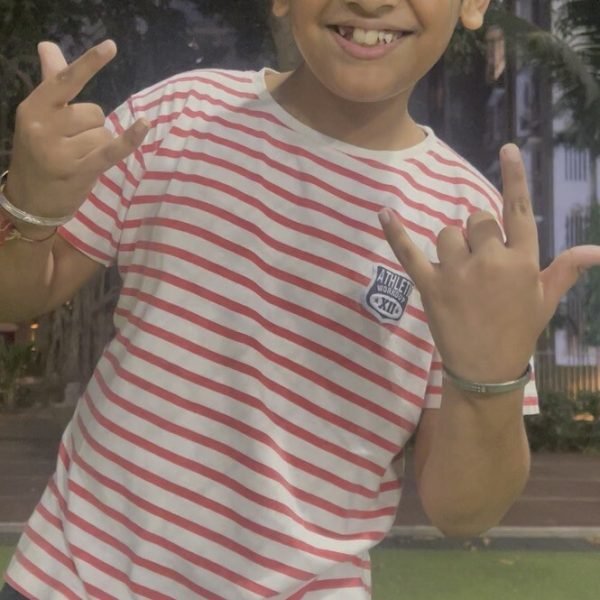 A happy young VHR Sports athlete grinning after training at Lodha Amara, Thane