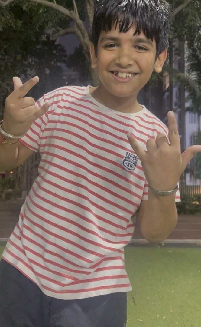 A happy young VHR Sports athlete grinning after training at Lodha Amara, Thane