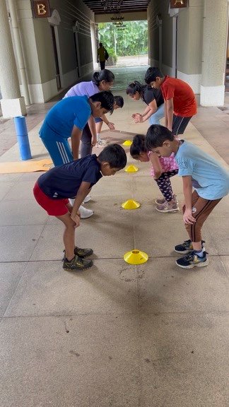 Athletes during the warm-up phase of a Little Champions session at VHR Sports