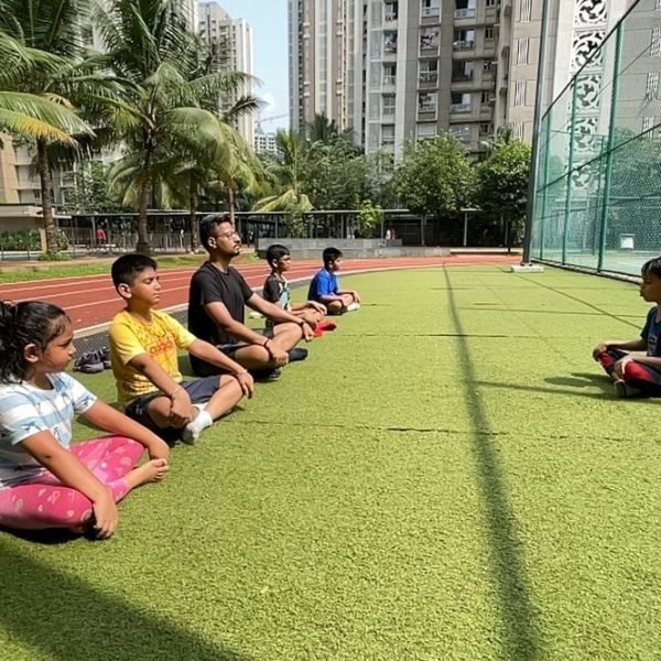 A group meditation and breathing session on the turf at VHR Sports